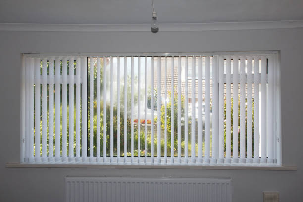 istock Window with vertical white blinds from the interior - DIY 1371243589