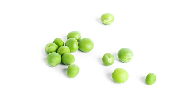 istock Green peas isolated on a white background 1371243655