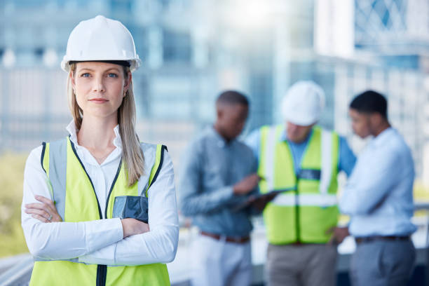 istock Shot of a young contractor with her team 1371246761