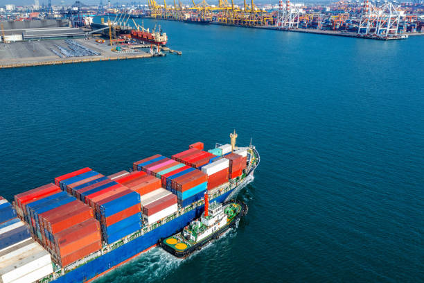 istock Aerial view of cargo ship and cargo container in harbor. 1371246871