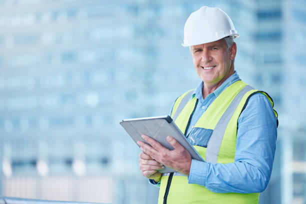 istock Shot of a mature male foreman using his digital tablet on site 1371247991