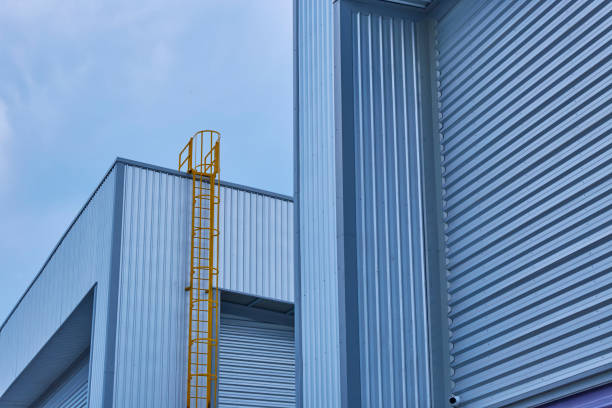 istock Yellow stairway on metal sheet building with blue sky 1371249450
