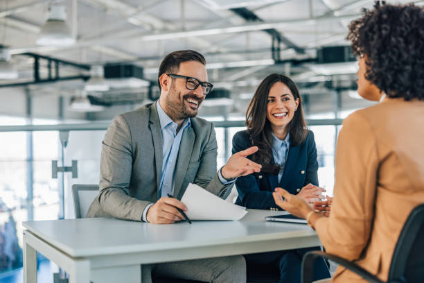 istock Smiling businesspeople having a conversation with each other. 1371256931