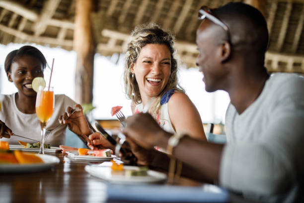 istock Cheerful friends talking during their lunch at a restaurant. 1371258190