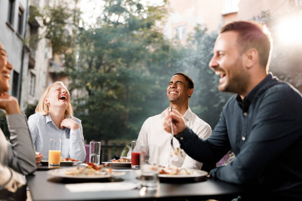 istock Cheerful business colleagues talking on a lunch in a restaurant. 1371258733