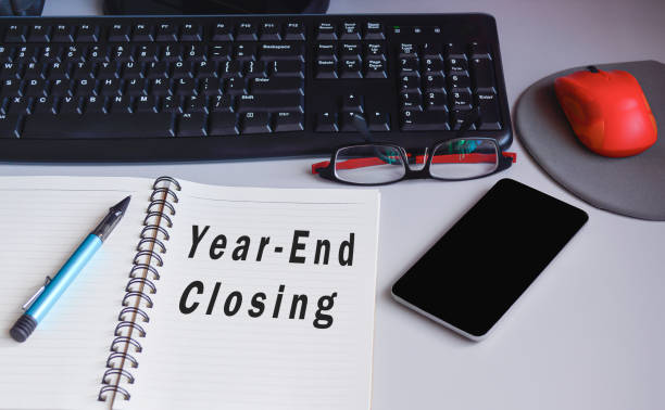 istock Text on notepad on a desk - Year end closing. Audit and accounting concept 1371260165