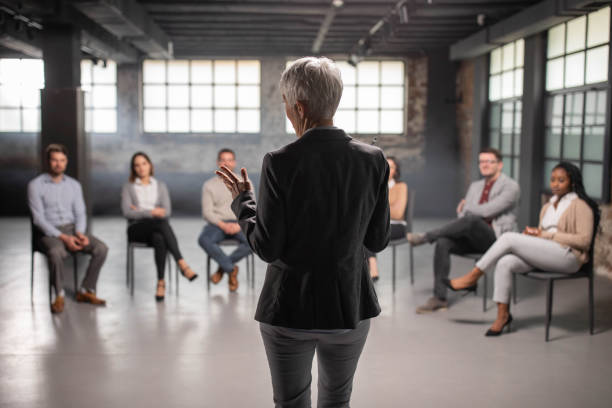 istock Rear view of a psychologist talking on a group therapy. 1371261616