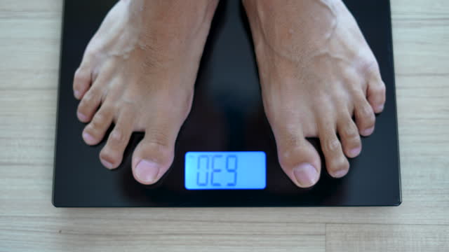 Close up standing on weighing scale