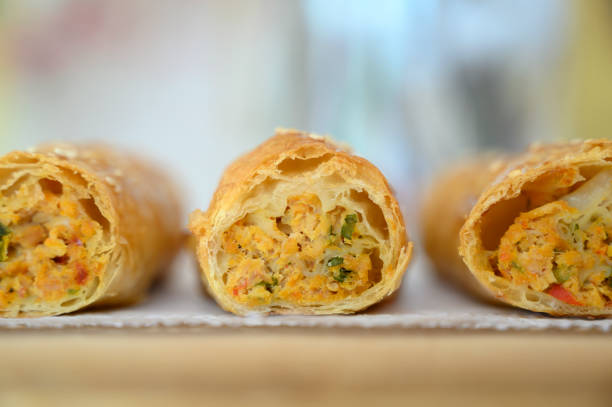 istock Iconic rustic Romanian and Moldavian pies with spinach and cheese filing on a light colored wooden boar 1371265296
