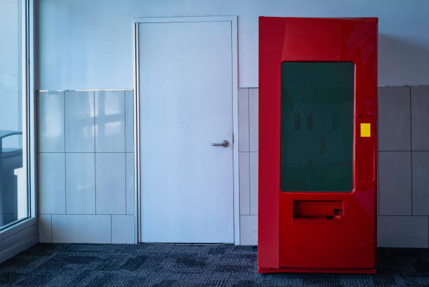 istock Red soda machine in the office building with a white door 1371266047
