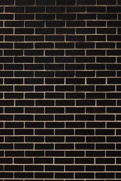 istock Part of a dark brick wall 1371272259