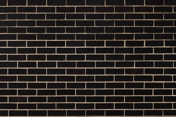 istock Part of a dark brick wall 1371272325