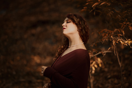 Beautiful and elegant young woman portrait showing her neck