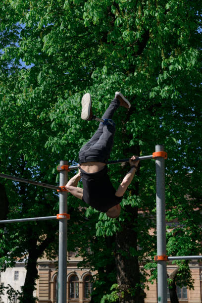 istock athletic young man with artificial leg working out on a bars 1371277537