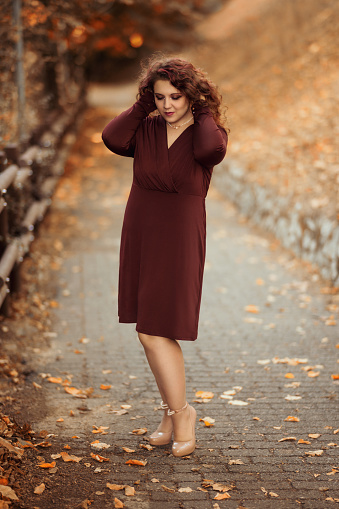 Beautiful and elegant young woman portrait in Autumn
