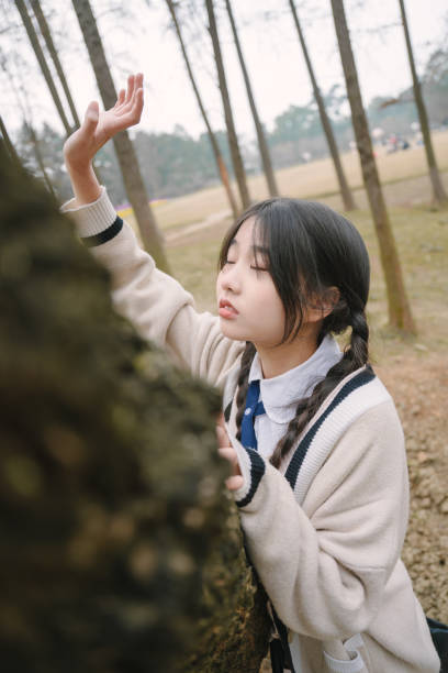 istock Beautiful asian girl under the tree 1371280324
