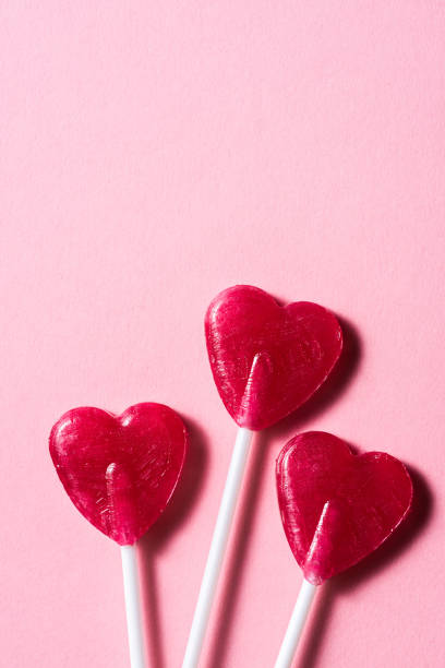 istock Broken heart concept background. Sweet red lollypop 1371282122