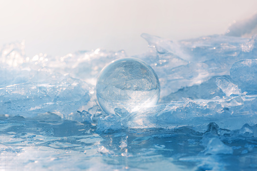 A clear ball of glass on the ice