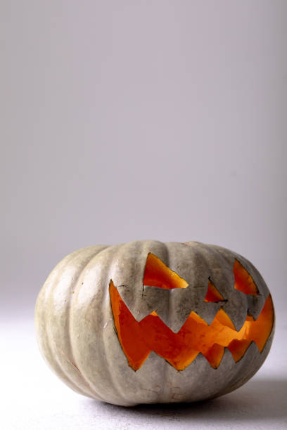 istock Composition of halloween jack o lantern and copy space on grey background 1371282937