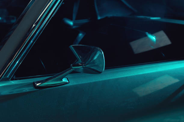 istock Side mirror of an American classic car in blue light. 1371284302