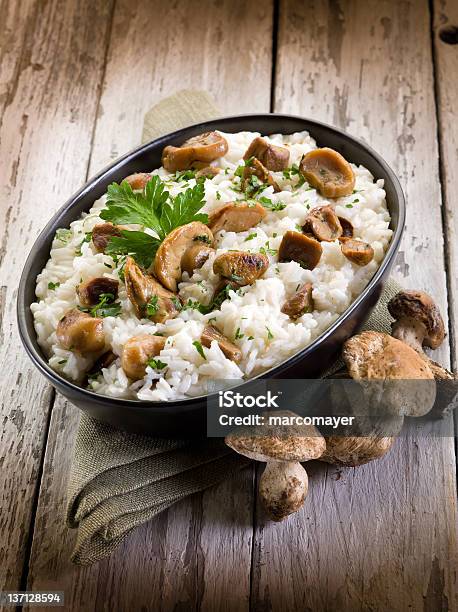 Risotto With Cep Edible Mushrooms Stock Photo - Download Image Now - Porcini Mushroom, Risotto, Parsley