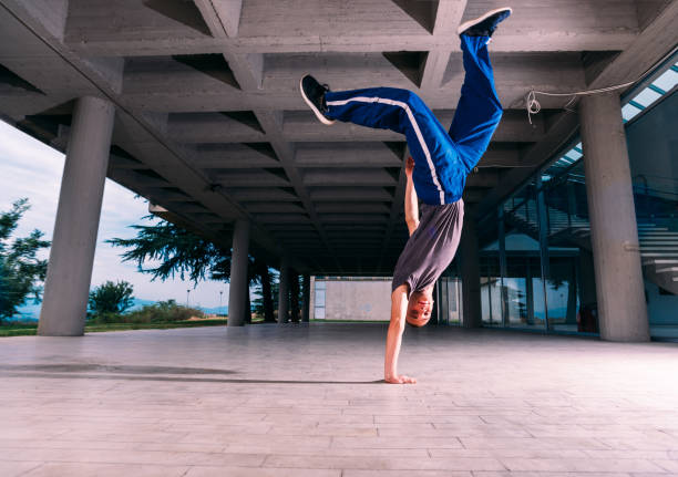 istock Young parkour man perform handstand at urban place 1371286786