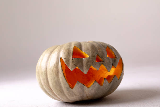 istock Composition of halloween jack o lantern and copy space on grey background 1371286854