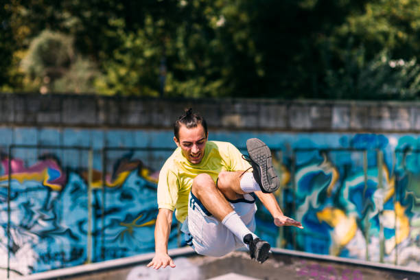 istock Sportive man in action while jump over obstacles 1371286998