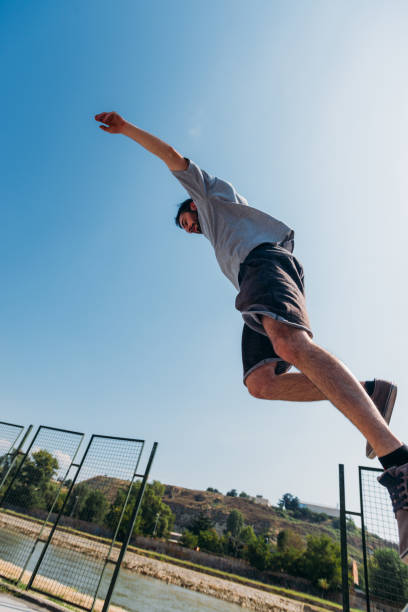 istock Young man doing tricks while jump in the air 1371287023