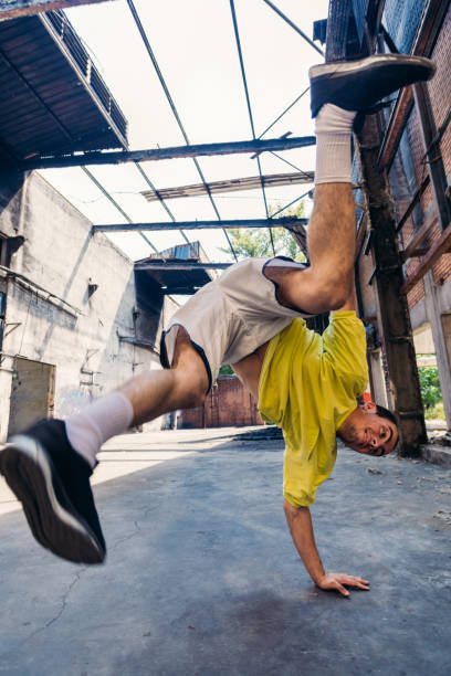 istock Parkour man exercise handstand outdoors 1371287248