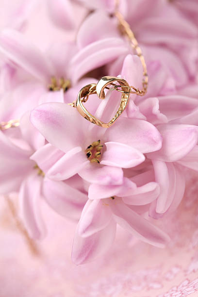 istock Gold necklace with heart on a hyacinth 137128889