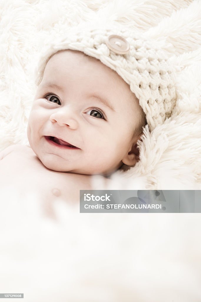 Cute 3-Months Baby Cute 3-Months Baby wearing a  white knit hat 0-11 Months Stock Photo