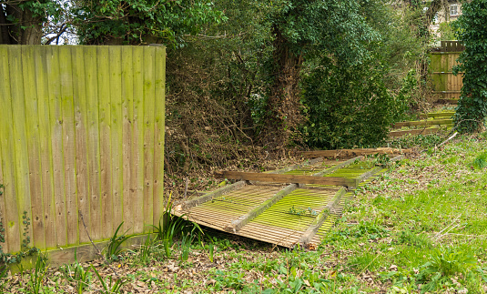 Excessive wind blows over fence panels possibly resulting in an insurance claim