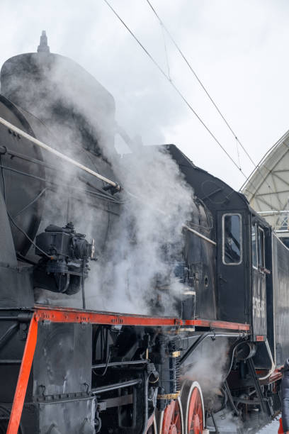 istock old retro steam train close up 1371291817