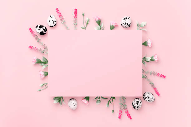 istock Easter composition. Easter eggs, flowers, paper blank on pastel pink background. Flat lay, top view, copy space. 1371296215