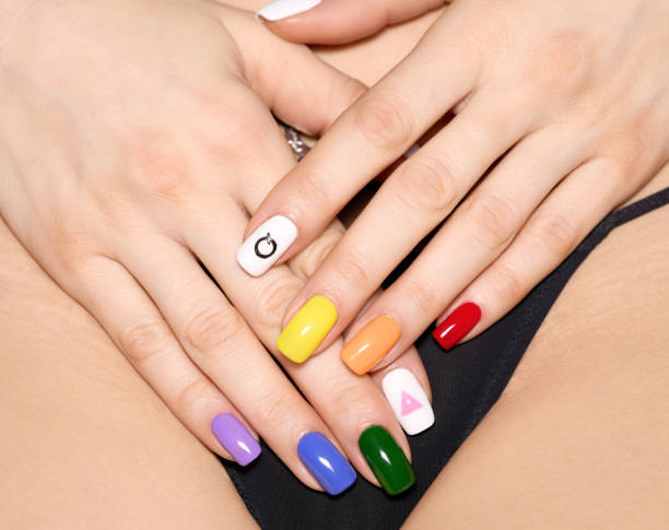 istock Hands with LGBT rainbow manicure 1371296295