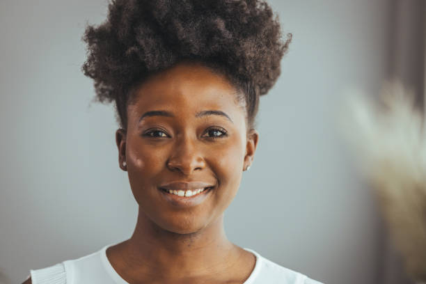 istock Happy woman smiling and looking at camera. 1371297907