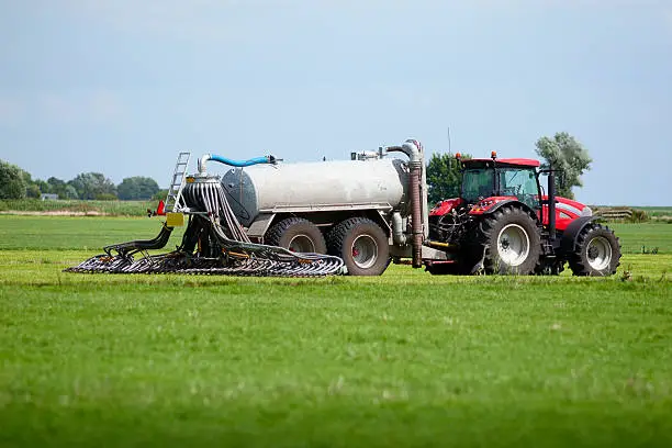 tractor with tank that can directly inject liquid manure into the ground for optimum nutrient placement and odor control