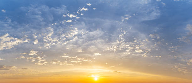 istock Cloudy morning sky with sun shine, panoramic nature background 1371300495