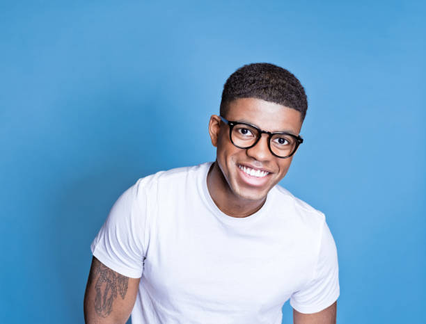 istock Cheerful young man wearing denim shirt 1371300579