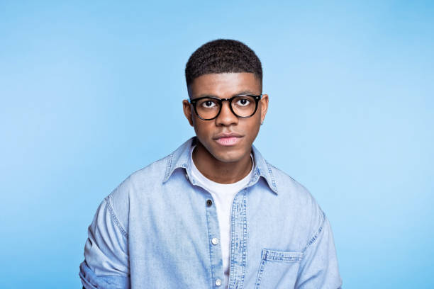 istock Confident young man wearing denim shirt 1371300766
