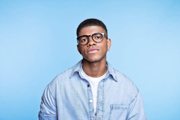 istock Confident young man wearing denim shirt 1371300930
