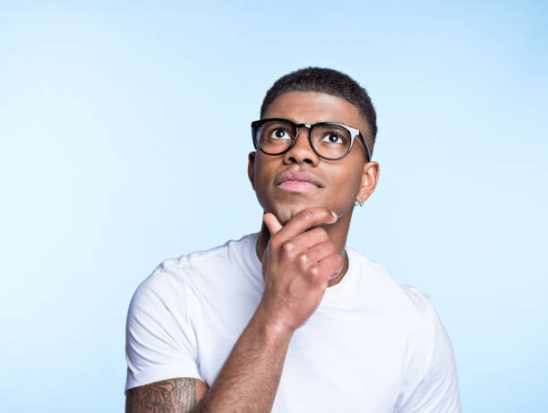istock Thoughtful young man wearing denim shirt 1371302227