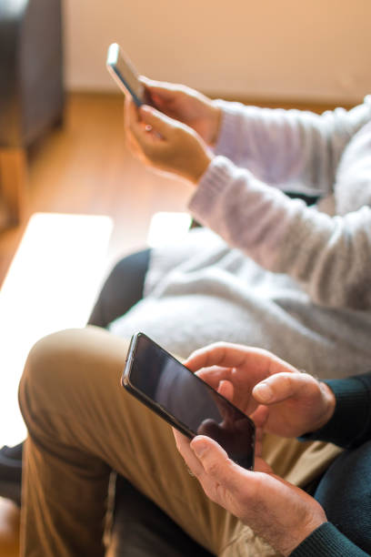 istock People using mobile phones at home 1371302237
