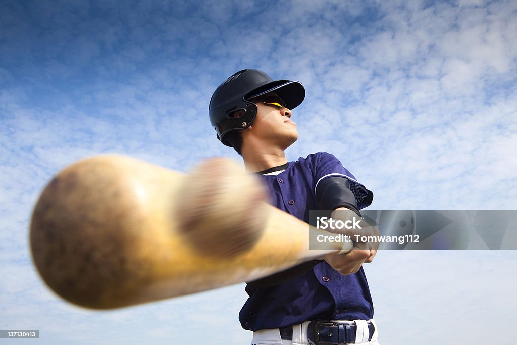 baseball player hitting young baseball player hitting the ball Baseball - Ball Stock Photo