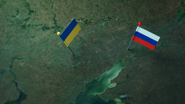 Russia and Ukrainian flags on the Russian and Ukraine border map. stock photo