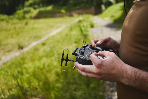 istock Man flying a high speed racing drone with remote controller.  remote aerial quadcopter drone 1371306244