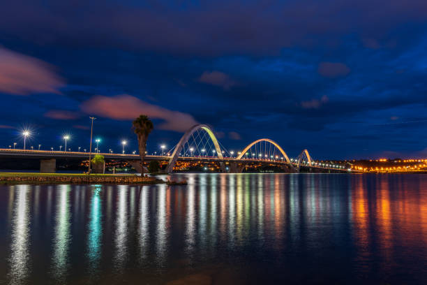 istock Reflections on lake from illuminated bridge at night 1371306348