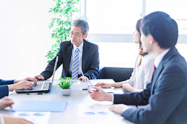 istock Business people working in a clean office 1371306628