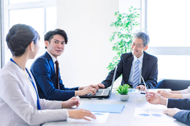 istock Business people working in a clean office 1371306636